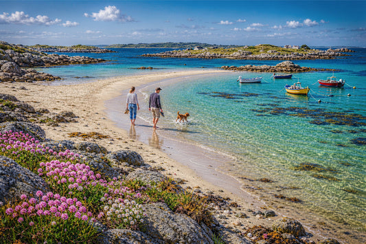 The Turquoise Shallows 1000-piece British coastal jigsaw puzzle with white sand, clear turquoise shallows, moored boats and thrift.